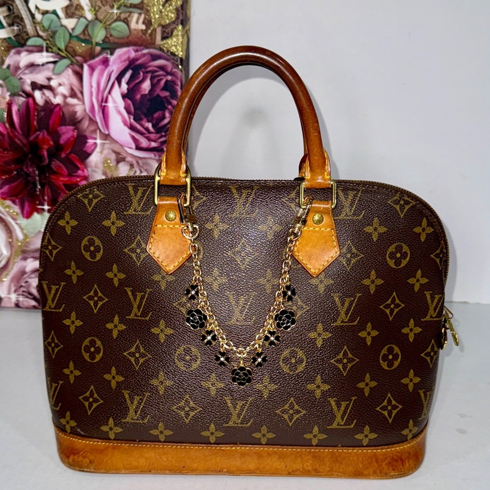 Louis Vuitton Brown Monogram Handbag with Gold Accents